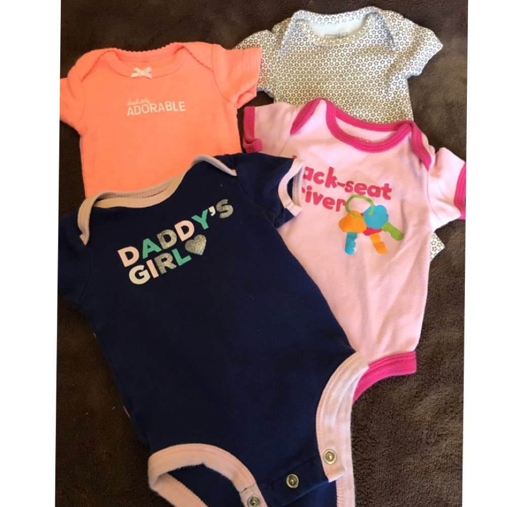 Bundle of four newborn girl onesies